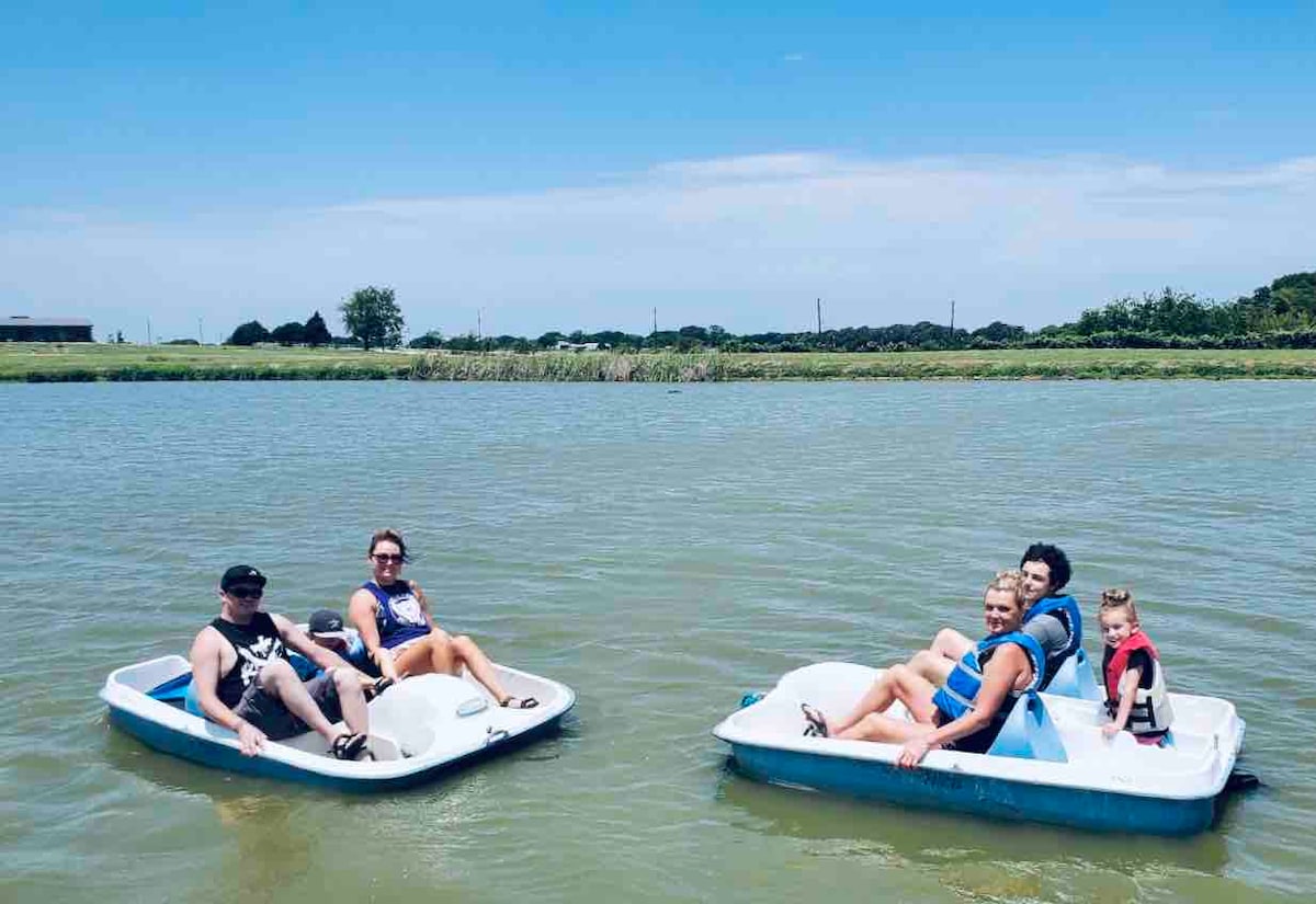 Family enjoying paddle boats on the private fishing pond