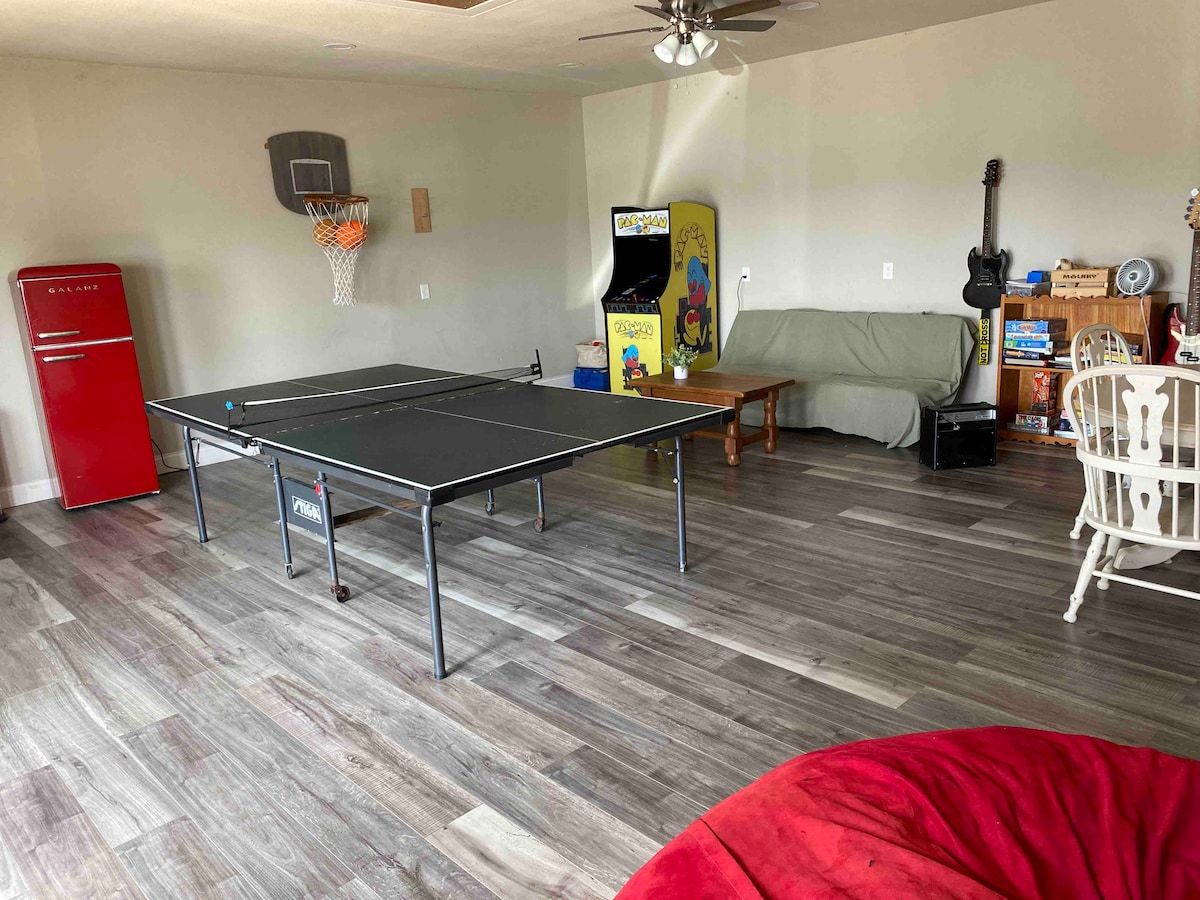 Game room with ping-pong table and arcade games