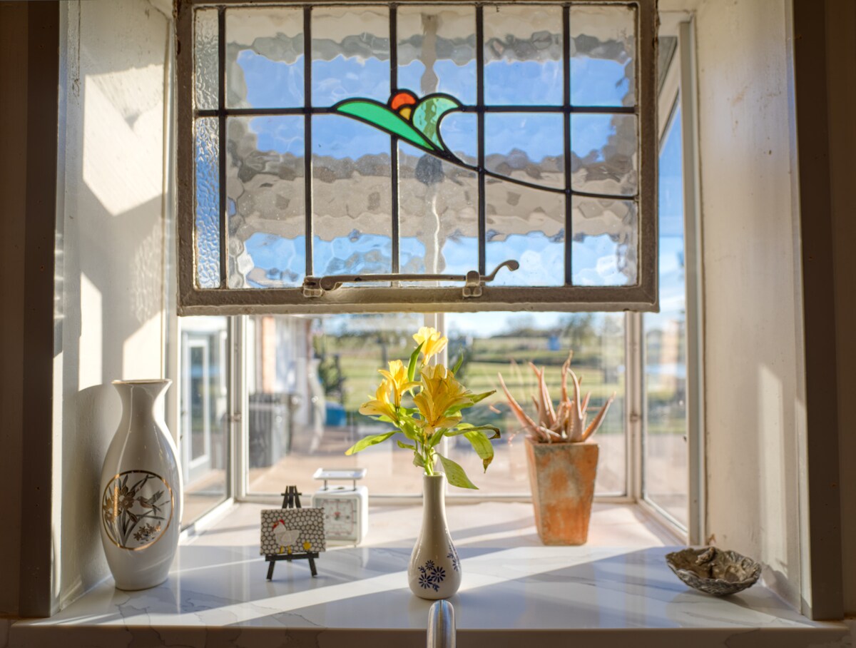 Sunlit window with fresh flowers