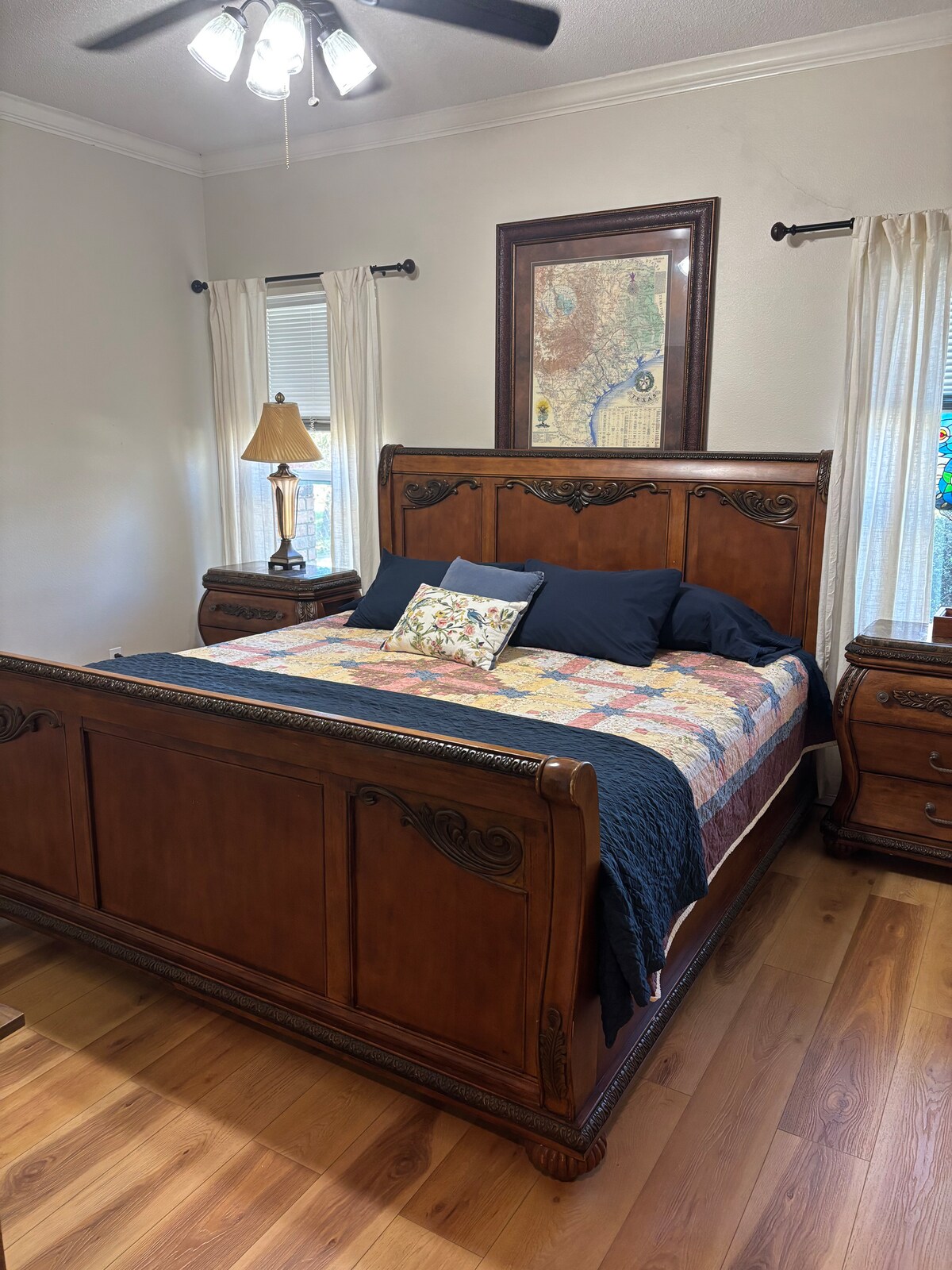 Guest bedroom with carved wood bed