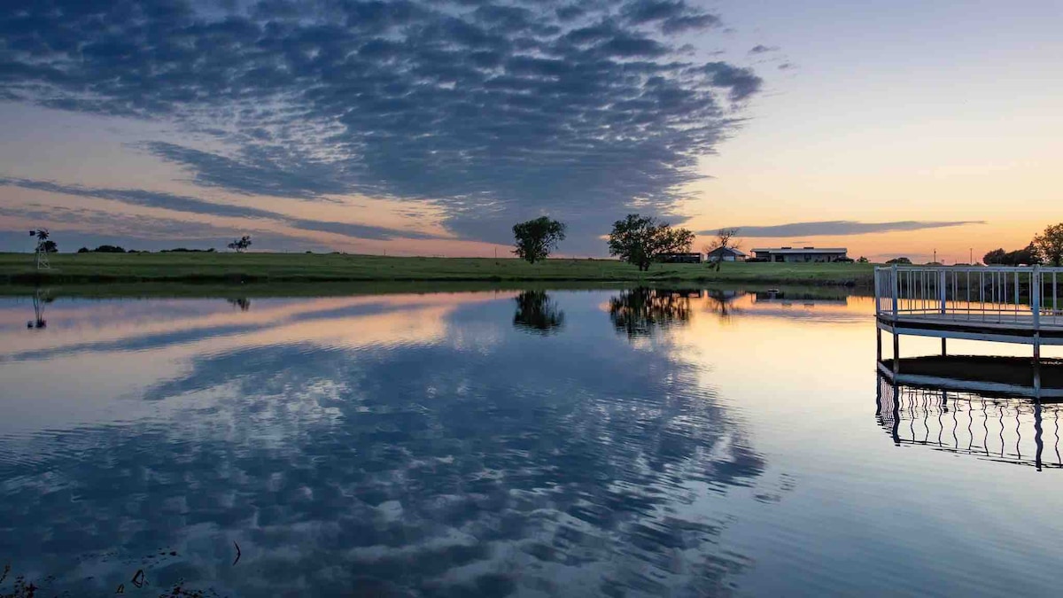 Sunset reflections over the pond and dock