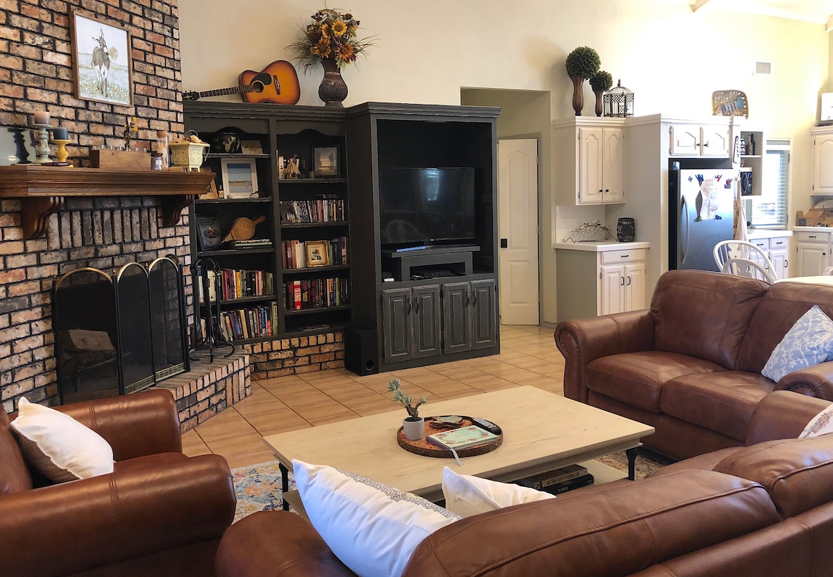 Living room with brick fireplace and comfortable seating