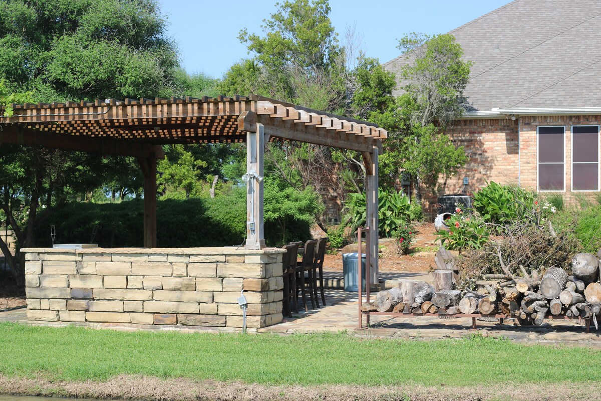 Stone pergola bar and patio
