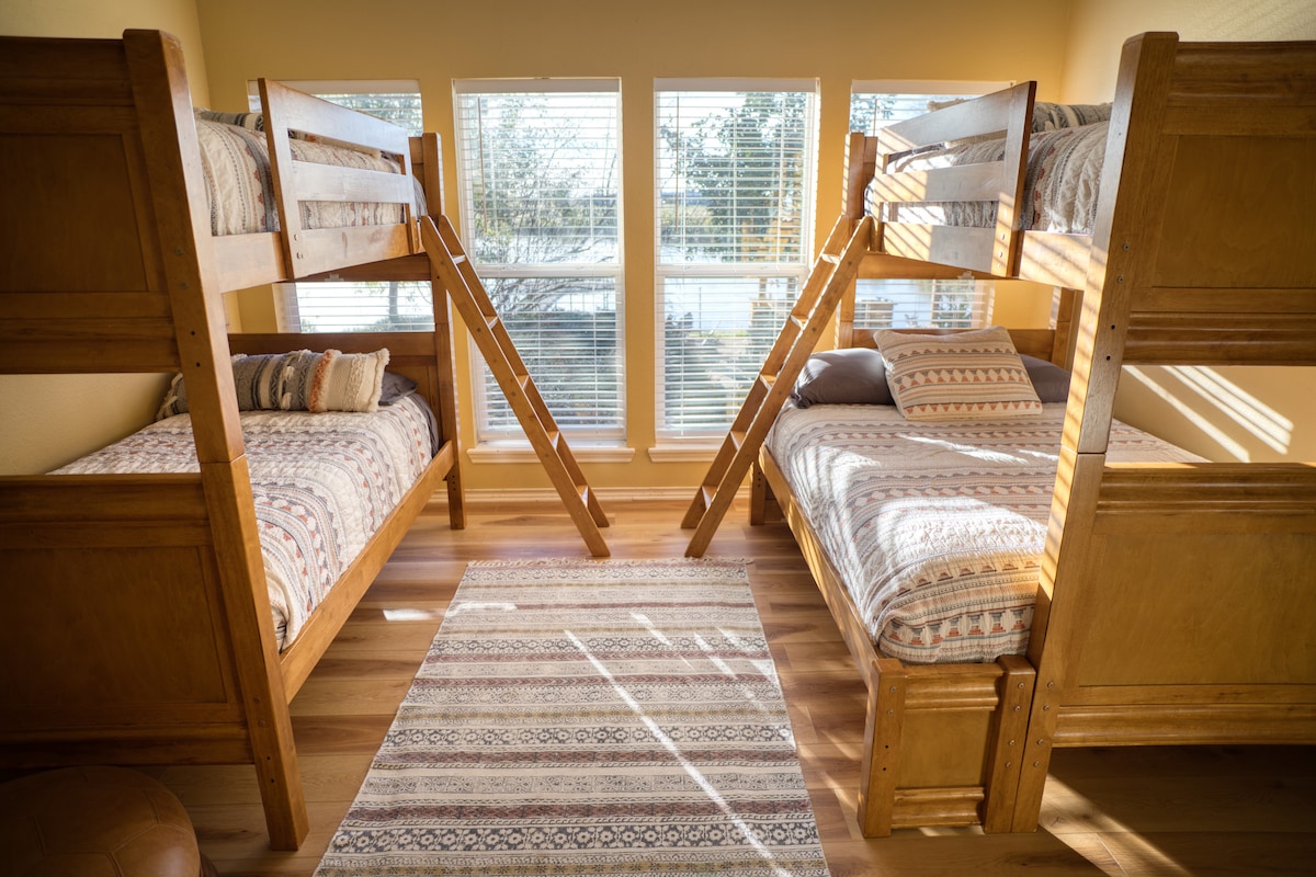 Bright bunk room with big windows