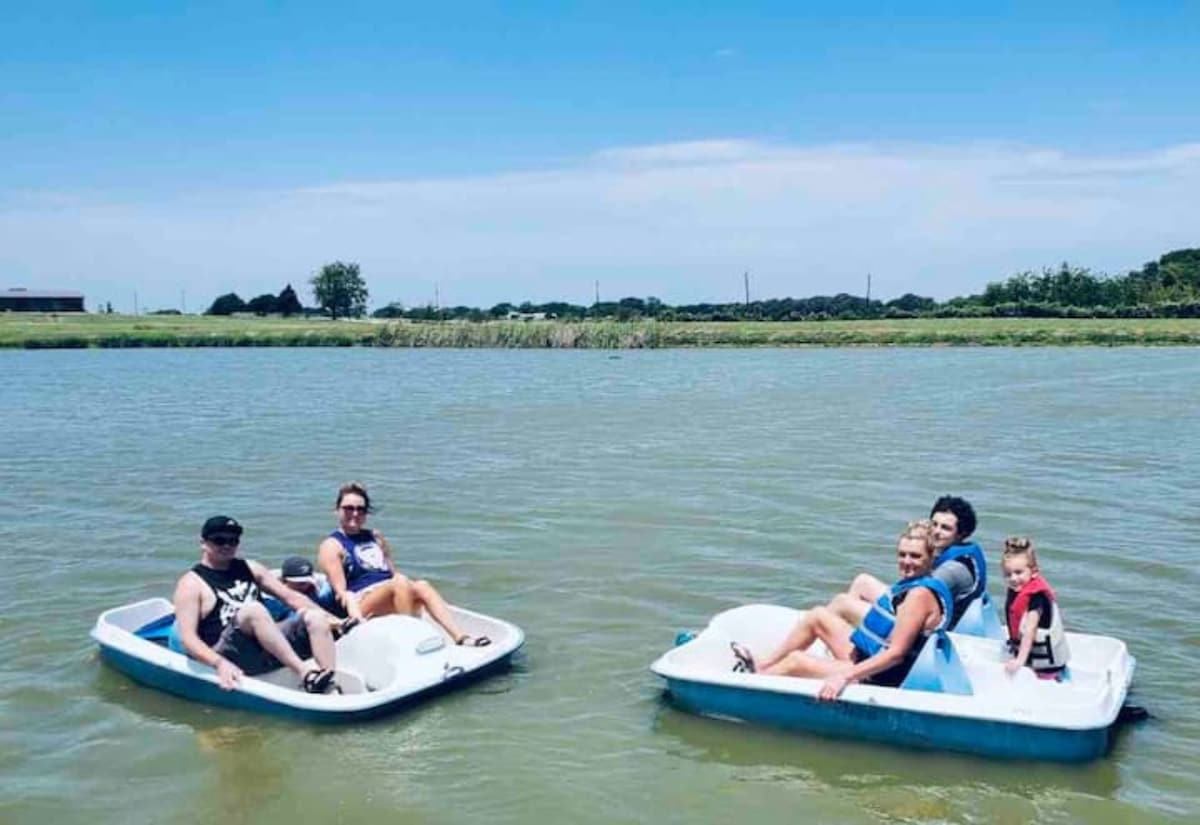Family enjoying paddle boats on the water