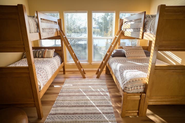 Bright bunk room with big windows